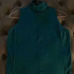 Teal sleeveless turtleneck